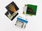 Images of Reality game cards and box