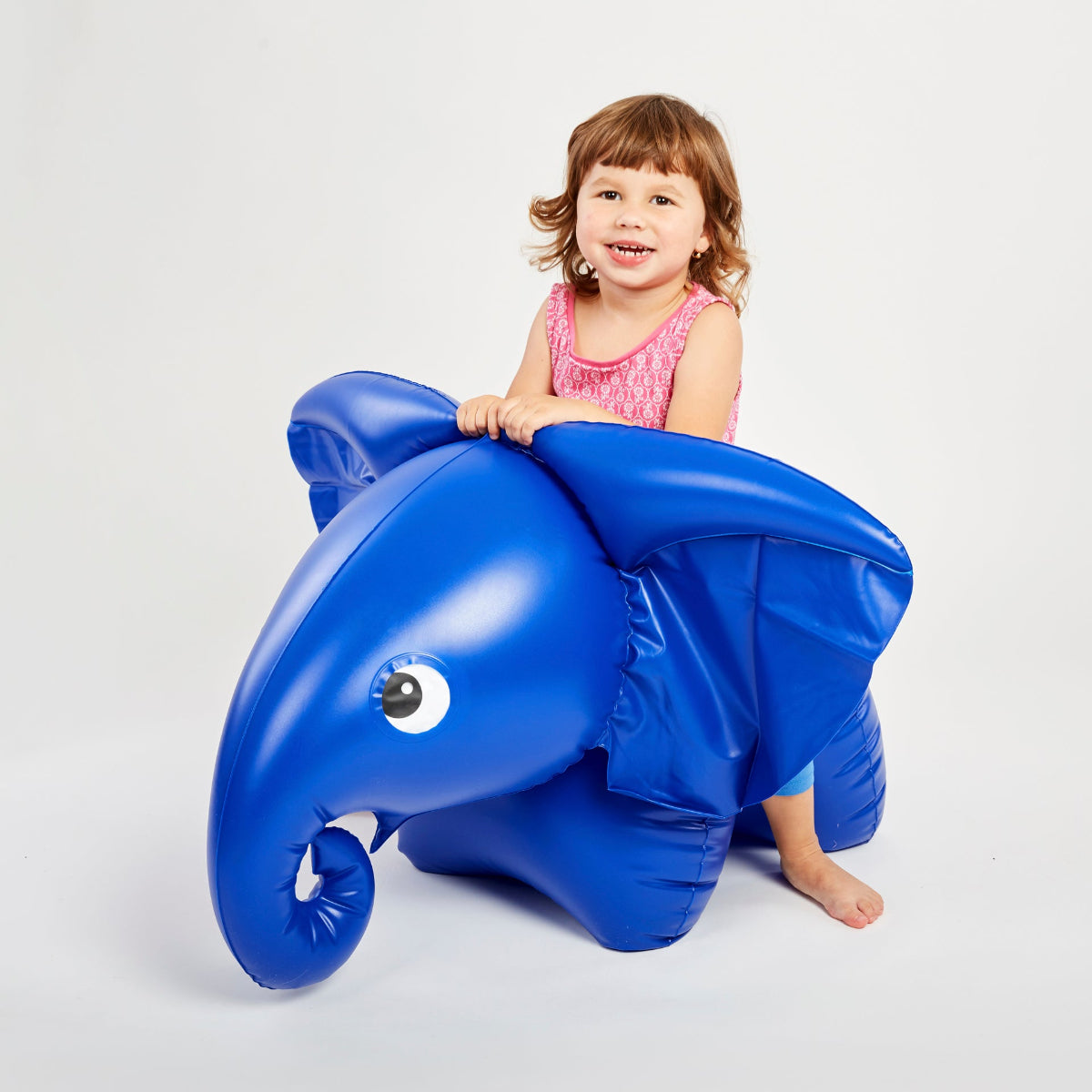 Inflatable elephant with a child sitting on it