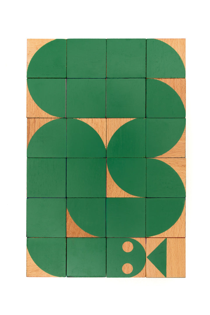 wooden blocks forming a green snake
