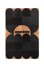 wooden blocks forming a black spider