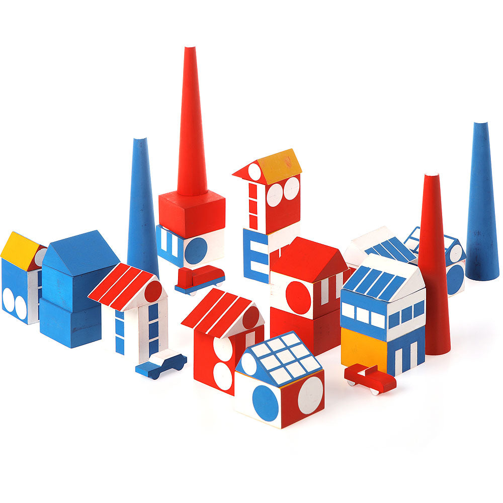 colorful wooden blocks shaped like houses, roofs, and chimneys